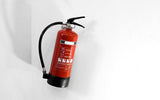 Red ABC fire extinguisher for home use in Singapore.